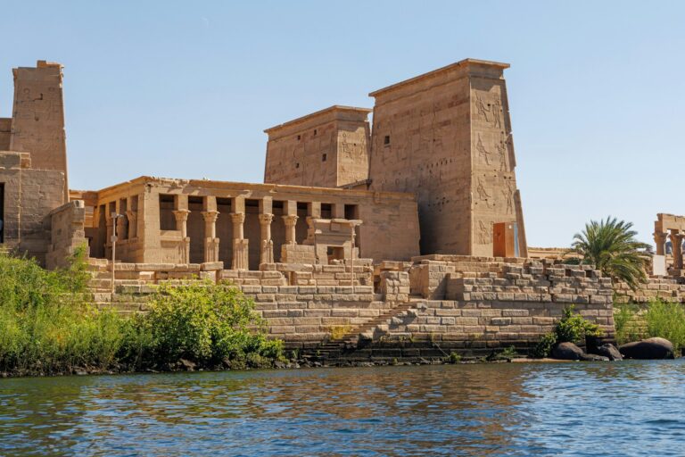 A body of water next to a large building